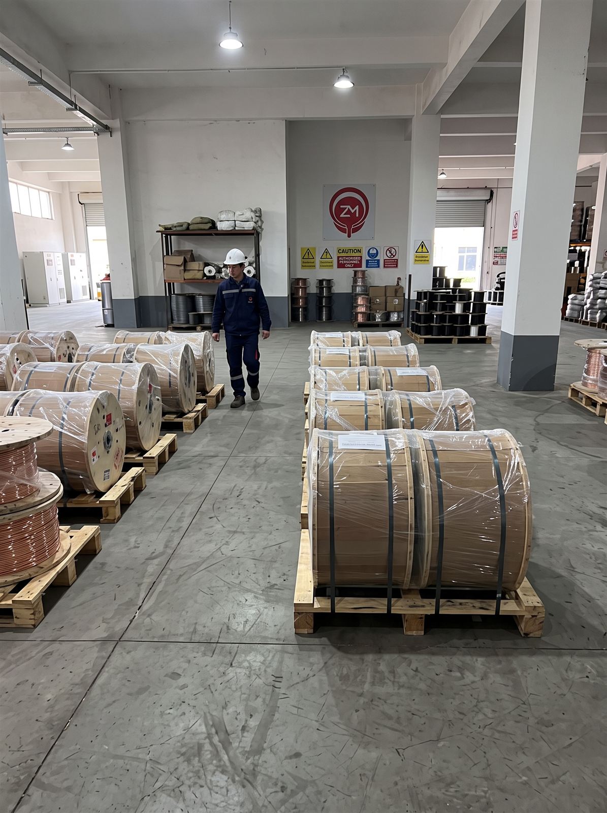 Copper wire on wooden spools in the Zermetal warehouse